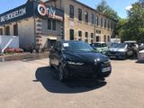 a black car parked in front of a building