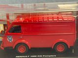 a red toy fire truck in a clear box