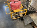two red gas cans sitting on a cart in a warehouse