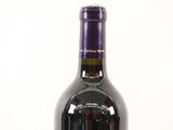 a bottle of wine that is sitting on a table