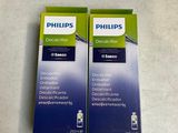 two boxes of philipss toothpaste on a counter top