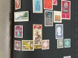 a black book with stamps on it sitting on a table