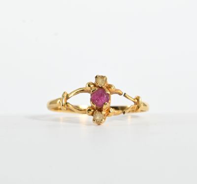 an image of a gold ring with a ruby stone in the center