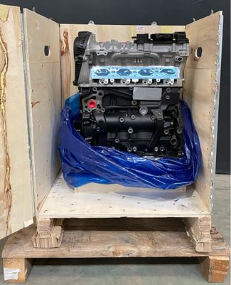 a small engine in a wooden box on a pallet