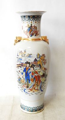 a vase with a painting on it sitting on a table