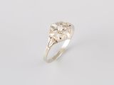 an image of a gold ring with a diamond in the center