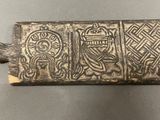 a close up of a metal object with a design on it