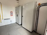 a room with a refrigerator and a freezer in it