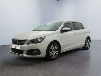 the white car is parked in a white room with a black floor