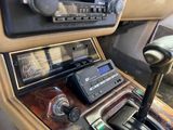 a car dashboard with a radio and other items in it