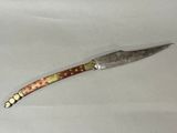 a knife that is laying on a table