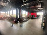 a photo of a room with chairs and a stage