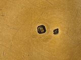 a close up of a wooden table with a metal object on it