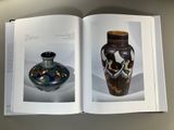 a book with a picture of a vase and a picture of a vase
