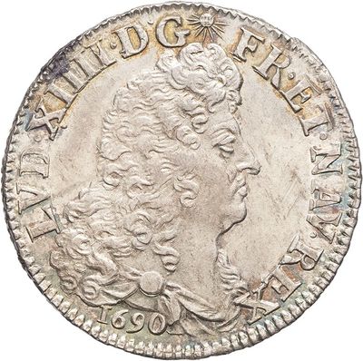 a silver coin with a woman ' s head on it