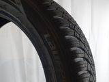 a close up of a tire on a white surface with a white background