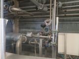 pipes and valves in a building with a lot of pipes