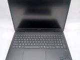 a laptop with a keyboard on it sitting on a table