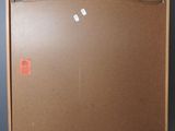 a picture of a brown refrigerator with a red tag on it