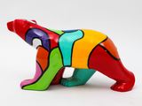 brightly colored bear figurine on a white surface with a white background
