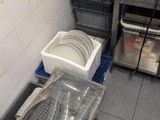 a small kitchen with a sink and a lot of dishes in it