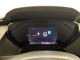 the dashboard of a car with a digital display in the center