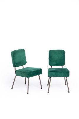 pair of green velvet chairs with metal legs
