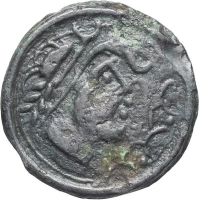 une pièce de monnaie ancienne sur laquelle figurent un cheval et un cavalier