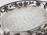 a glass platter with a leaf design on it