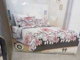 a picture of a bed in a box on the floor