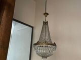 a chandelier hanging from the ceiling in a room