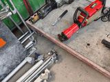 many tools that are sitting on the floor in the garage