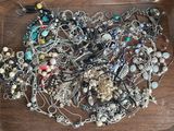 a tray with many different types of jewelry on it