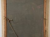 a chalkboard with a rope hanging on the wall