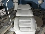 an image of a dental room with a table and chairs
