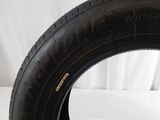 a close up of a tire on a white surface with a white background
