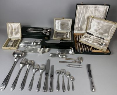 an assortment of silverware including forks, spoons, and knives