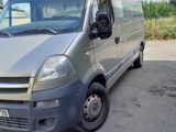 a silver van that is parked in a parking lot