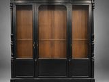 a black and wood display cabinet with glass doors