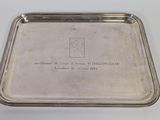 a silver tray with a picture of a man on it