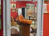a mirror that is sitting on the floor in front of a red wall