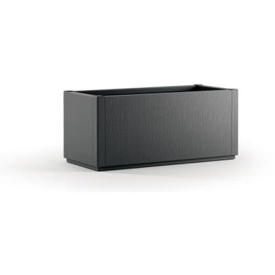the large black planter is sitting on a white surface