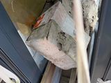 a pile of trash sitting on the floor next to a door