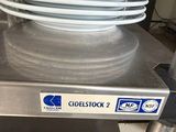 a stack of plates sitting on a table in a kitchen