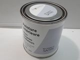 an image of a can of paint sitting on a table