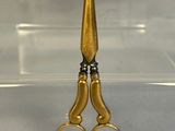 a pair of scissors that are sitting on a table