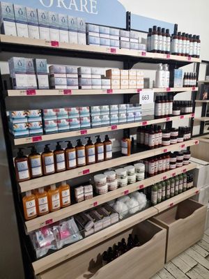 many bottles of skin care on the shelves in the store
