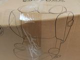 someone is holding a cardboard box with a drawing of a cat on it
