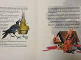 an open book with a picture of a bird on it