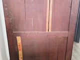 an old wooden dresser with a wooden top and two drawers